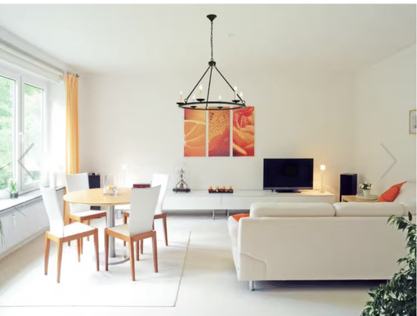 Screenshot 2025-11-24 at 10.41.48 AM Farmhouse 8-Light Wagon Wheel Chandelier – Black Metal Ring Dining Room & Entryway Lighting